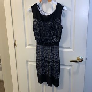 Sleeveless black and white dress with beautiful detailing